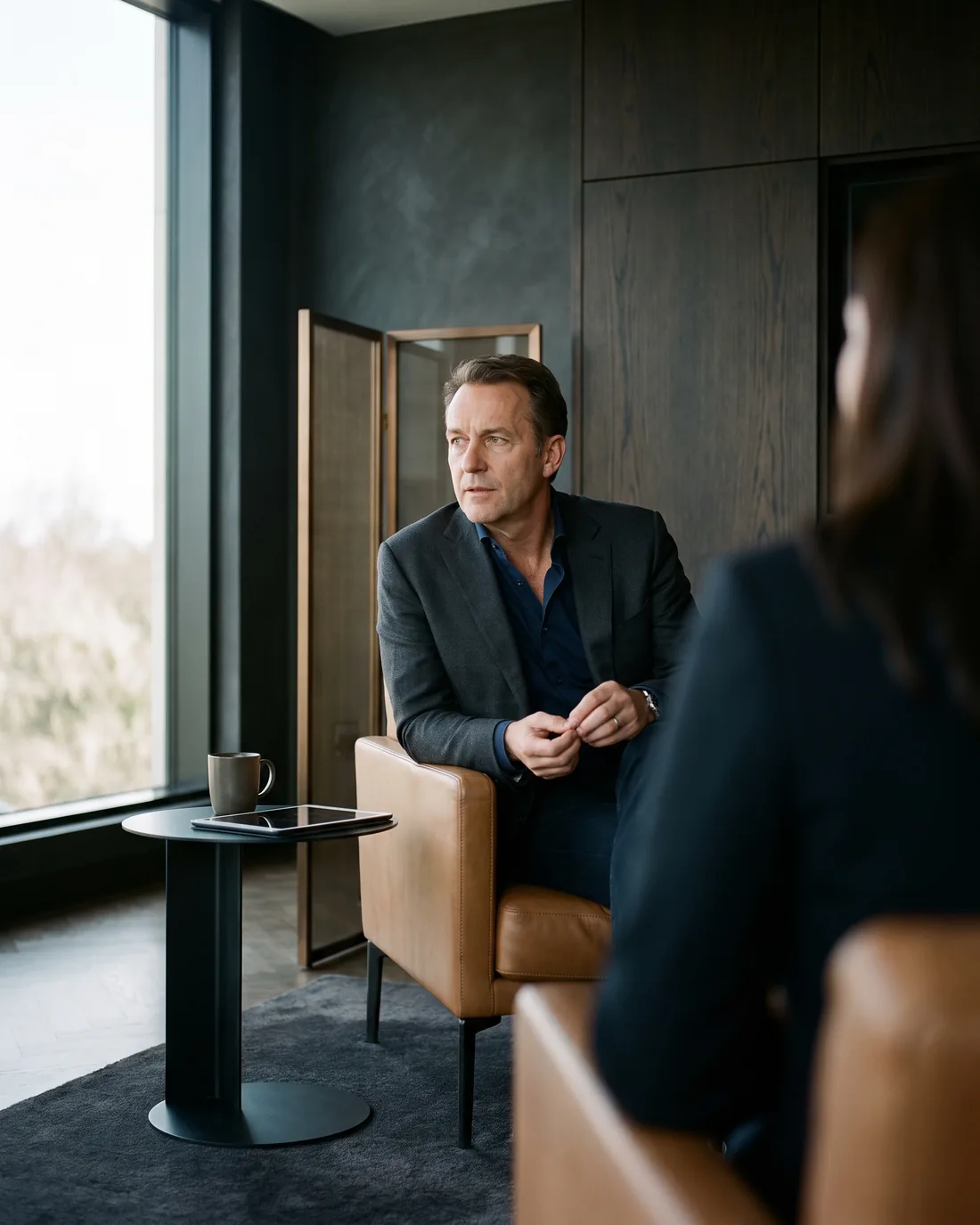 A senior CHRO reviewing the work in a calm Tokyo boardroom